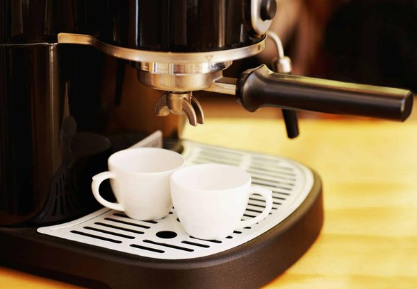 Quelle machine à expresso avec porte-filtre professionnel offre la meilleure qualité de café ?